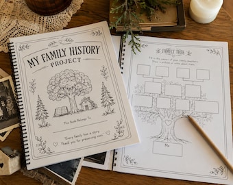 May include: A spiral-bound family history project book with a white cover featuring a black ink illustration of a tree, a house, and an open book. The text reads My Family History Project, This Book Belongs To, and Every family has a story.
