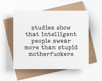May include: A white rectangular greeting card with black typewriter-style text that reads: studies show that intelligent people swear more than stupid motherfuckers. The card is placed on top of a plain brown paper envelope.