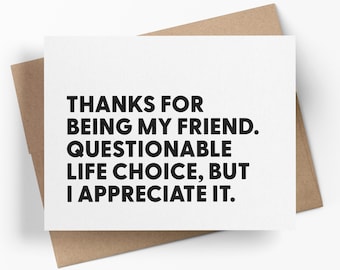 May include: A white rectangular greeting card with black text that reads: THANKS FOR BEING MY FRIEND. QUESTIONABLE LIFE CHOICE, BUT I APPRECIATE IT. The card is placed on top of a brown paper envelope, creating a simple and clear visual presentation.