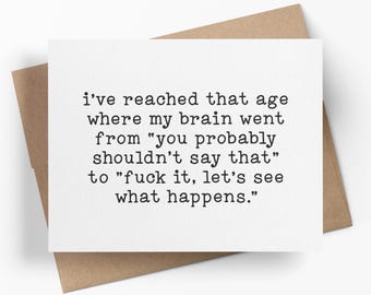 May include: A white rectangular greeting card with black typewriter-style text that reads: i've reached that age where my brain went from "you probably shouldn't say that" to "fuck it, let's see what happens." The card rests on a brown envelope.