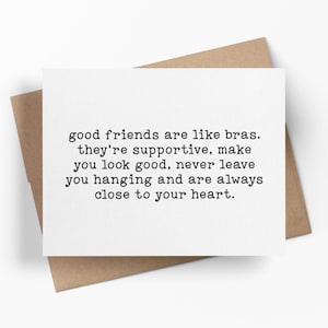 May include: A white greeting card with black typewriter-style text that reads: good friends are like bras. they're supportive, make you look good, never leave you hanging and are always close to your heart. The card rests on a brown envelope.