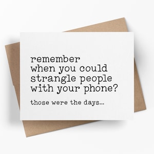 May include: A white rectangular greeting card with black typewriter-style text that reads: remember when you could strangle people with your phone? those were the days... The card is positioned on top of a brown kraft paper envelope.