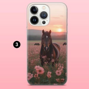 May include: A clear phone case with a brown horse in a field of pink flowers at sunset. The horse has a white marking on its forehead. The background shows a pink sky and distant hills. The case has a camera cutout.