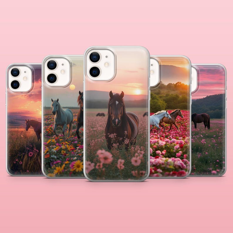 May include: Several phone cases showcasing images of horses in a field of flowers at sunset. The cases depict various horses, including brown, white, and grey, set against a colourful sky. The cases are made of clear plastic.