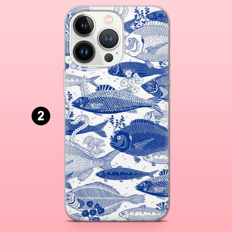 May include: A white phone case with a blue fish pattern. The design features various fish illustrations in a detailed, artistic style. The case has a glossy finish and a camera cutout.