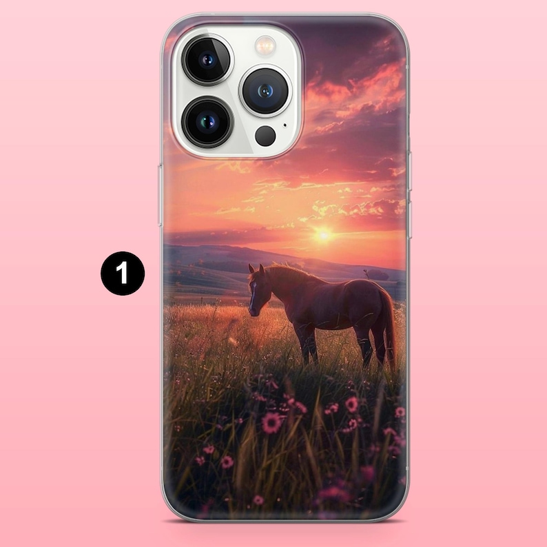 May include: A clear phone case depicting a sunset with a brown horse in a field of tall grass and wildflowers. The sky is filled with orange and pink hues, and the sun is setting. The phone case has a clear border.