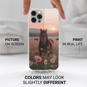 May include: A clear phone case with a horse image in a field of pink flowers at sunset. The case has text that reads "PICTURE ON SCREEN" and "PRINT IN REAL LIFE". The bottom of the case reads "COLORS MAY LOOK SLIGHTLY DIFFERENT".