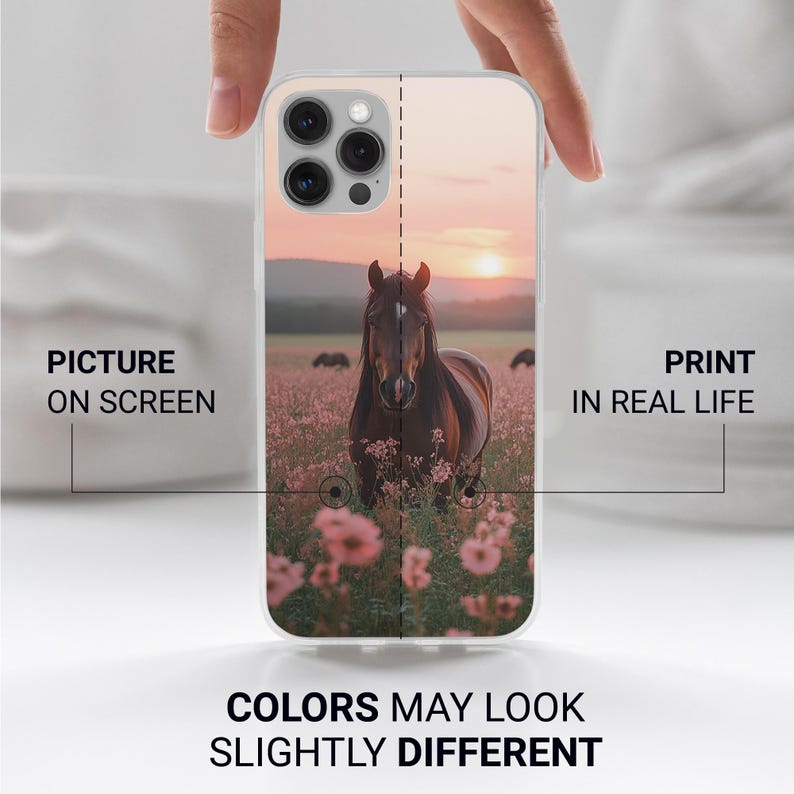May include: A clear phone case with a horse image in a field of pink flowers at sunset. The case has text that reads "PICTURE ON SCREEN" and "PRINT IN REAL LIFE". The bottom of the case reads "COLORS MAY LOOK SLIGHTLY DIFFERENT".