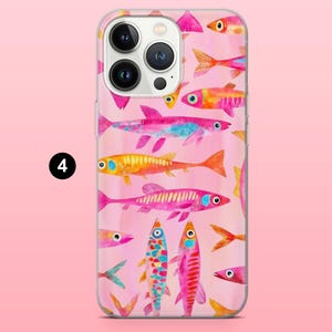May include: A clear phone case featuring a colorful watercolor pattern of various fish in shades of pink, orange, yellow, and blue. The fish are arranged on a pink background. The phone case has a black number 4 in a white circle.
