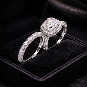 Cushion Cut Moissanite Double Halo Bridal Ring Set · Sterling Silver Pavé Band Wedding Set