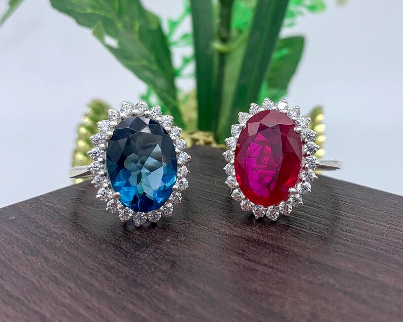 Elegant sterling silver ruby halo ring and blue sapphire halo ring.