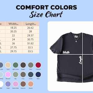 May include: A dark grey t-shirt with a size chart and colour swatches. The size chart shows measurements in inches for width and length. The shirt has a round neckline and a pendant necklace. The colour swatches include shades of blue, pink, and brown.