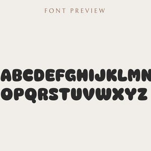 May include: A font preview displays the alphabet in a bold, rounded, black font. The letters are arranged in two rows against a beige background. The text "FONT PREVIEW" is at the top in a brown color.