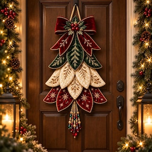 May include: A decorative door hanging shaped like a tree, featuring layered velvet leaves in deep red, dark green, and cream with gold embroidery. It is topped with a large red velvet bow and holly berries, and finished with a beaded tassel of red and green crystals.