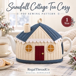 May include: A Snowfall Cottage Tea Cosy PDF sewing pattern by RegalThreadCo. The tea cosy is shaped like a house with a blue roof, cream walls, a red door, and two round windows. It features a small chimney and a top loop for hanging.