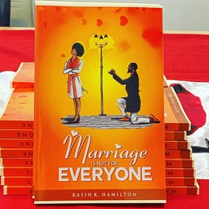 May include: A stack of books with the title "Marriage is Not for Everyone" on the cover. The cover art features a couple under a street lamp. The book's cover is orange with white text and a picture of a man proposing to a woman.