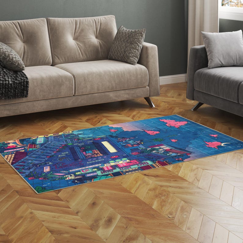 May include: A rectangular area rug with a vibrant cityscape design. The rug features a blue background with buildings, streets, and neon lights in shades of pink, green, and yellow. The rug is placed on a wooden floor.