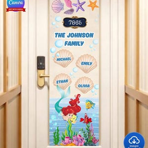 May include: A door decal featuring a mermaid theme. The design includes the family name, individual names in seashell shapes, and the house number. The decal has a blue and green color scheme with sea creature illustrations.