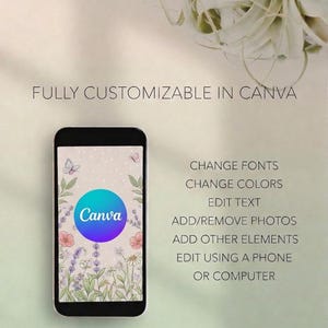 May include: A black smartphone displays a Canva design with a floral background and a blue and purple circle logo. Text on the phone and in the image states: "FULLY CUSTOMIZABLE IN CANVA" and "CHANGE FONTS, CHANGE COLORS, EDIT TEXT, ADD/REMOVE PHOTOS, ADD OTHER ELEMENTS, EDIT USING A PHONE OR COMPUTER."