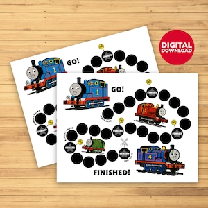 May include: Two white reward charts featuring cartoon trains. Each chart has a path of black circles, with train illustrations at the start and finish. The charts have the words "GO!" and "FINISHED!" and a red circle that says "DIGITAL DOWNLOAD".