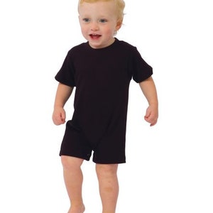 May include: A toddler wearing a dark brown short-sleeved onesie. The onesie has a round neckline and a snap closure at the crotch.