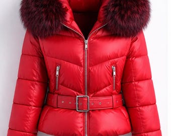 May include: A vibrant red puffer jacket with a plush, burgundy fur-trimmed hood. The jacket features a belted waist, a zipper closure, and two zippered pockets. The sleeves have ribbed cuffs. This winter coat is designed for warmth and style.