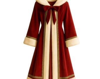 May include: A long-sleeved, deep red coat featuring a wide, cream-colored faux fur hood, cuffs, and front trim. The coat includes a prominent red bow at the neckline and gold-toned decorative piping along the edges of the cream-colored trim.