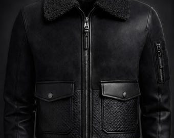 May include: A black jacket featuring a textured shearling collar, a central zipper closure, and two front flap pockets with snap buttons. The lower front panels have a quilted pattern, while the sleeves include a zippered utility pocket.
