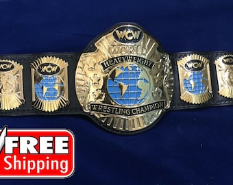 May include: A gold and black WCW World Heavyweight Wrestling Champion belt. The belt features a large gold center plate with a blue globe design and the words "World Heavyweight Wrestling Champion". Smaller gold plates with blue globe designs are on the black leather strap.