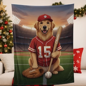 May include: A soft blanket depicting a golden retriever in a baseball uniform, number 15, holding a bat and ball. A baseball mitt lies nearby. The backdrop shows a stadium at dusk. The name "Charlie" is on the bat and mitt.