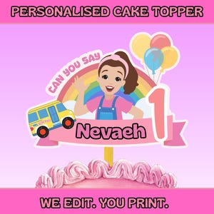 May include: A personalized cake topper with the text "PERSONALISED CAKE TOPPER". The design features a cartoon girl, a school bus, balloons, and the name "Nevaeh" with the number "1". The text "CAN YOU SAY" and "WE EDIT. YOU PRINT." are also included.