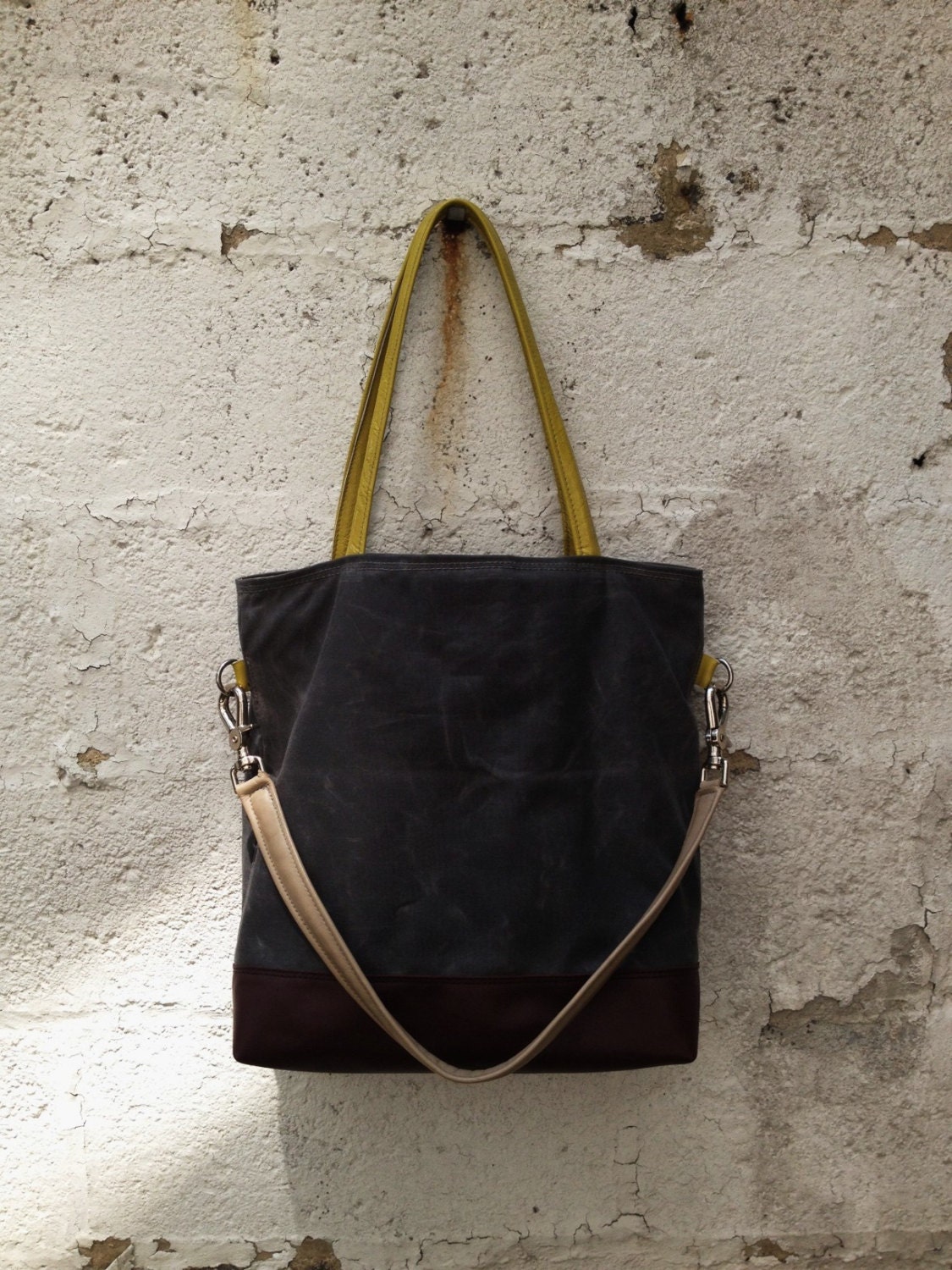 Tote bag waxed canvas charcoal color leather bottom in tan color,with handles and closures in leather