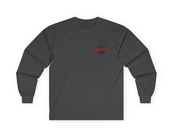 May include: Dark gray long-sleeve shirt with the word "Retribution" in red script on the upper left chest. The shirt is made of a soft material and has a crew neck.