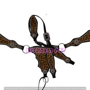 May include: A brown and black horse breast collar with a leopard print design. The collar features silver-colored accents and black leather straps. The text "FORZEN PET" is visible on the collar.