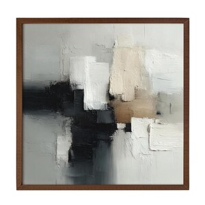 May include: Abstract art painting in a wooden frame. The artwork features a textured surface with a palette of white, black, gray, and beige rectangular shapes. The painting has a modern, minimalist aesthetic.