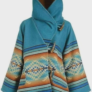 May include: A turquoise hooded coat with a Southwestern-inspired pattern. The coat features a high collar, wooden toggle closures, and a geometric design in shades of orange, blue, and cream. The sleeves and lower portion of the coat have horizontal stripes.
