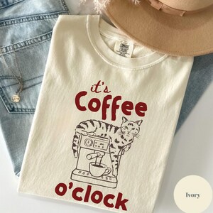 coffee cat shirt, funny cat tee, cat lover gift, coffee lover tee, cute cat shirt, cat graphic tee, coffee time shirt, cat mom shirt, aesthetic cat tee, vintage cat shirt, funny coffee tee, cat design shirt, gift for cat lover