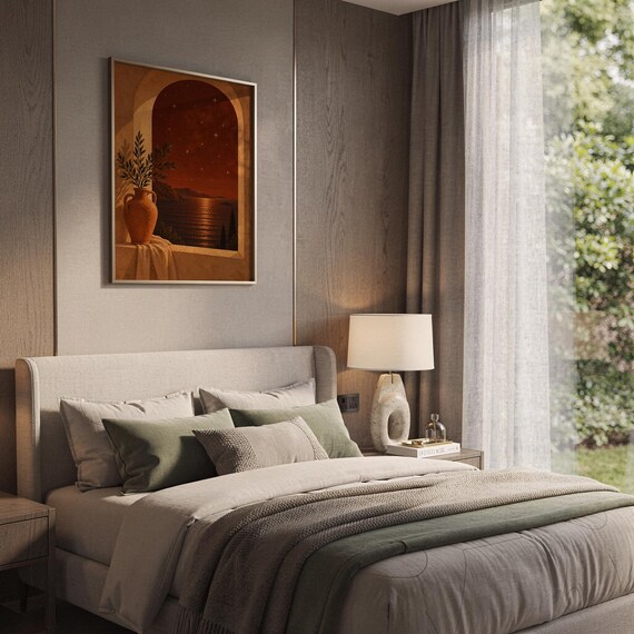 Mediterranean night sea wall art print hanging above a bed with sage green pillows in a calm neutral bedroom.