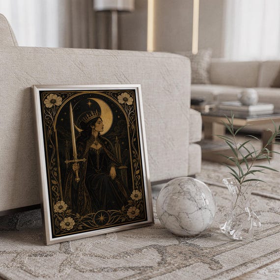 Gothic moon queen wall art print standing on a countertop in a modern white kitchen.