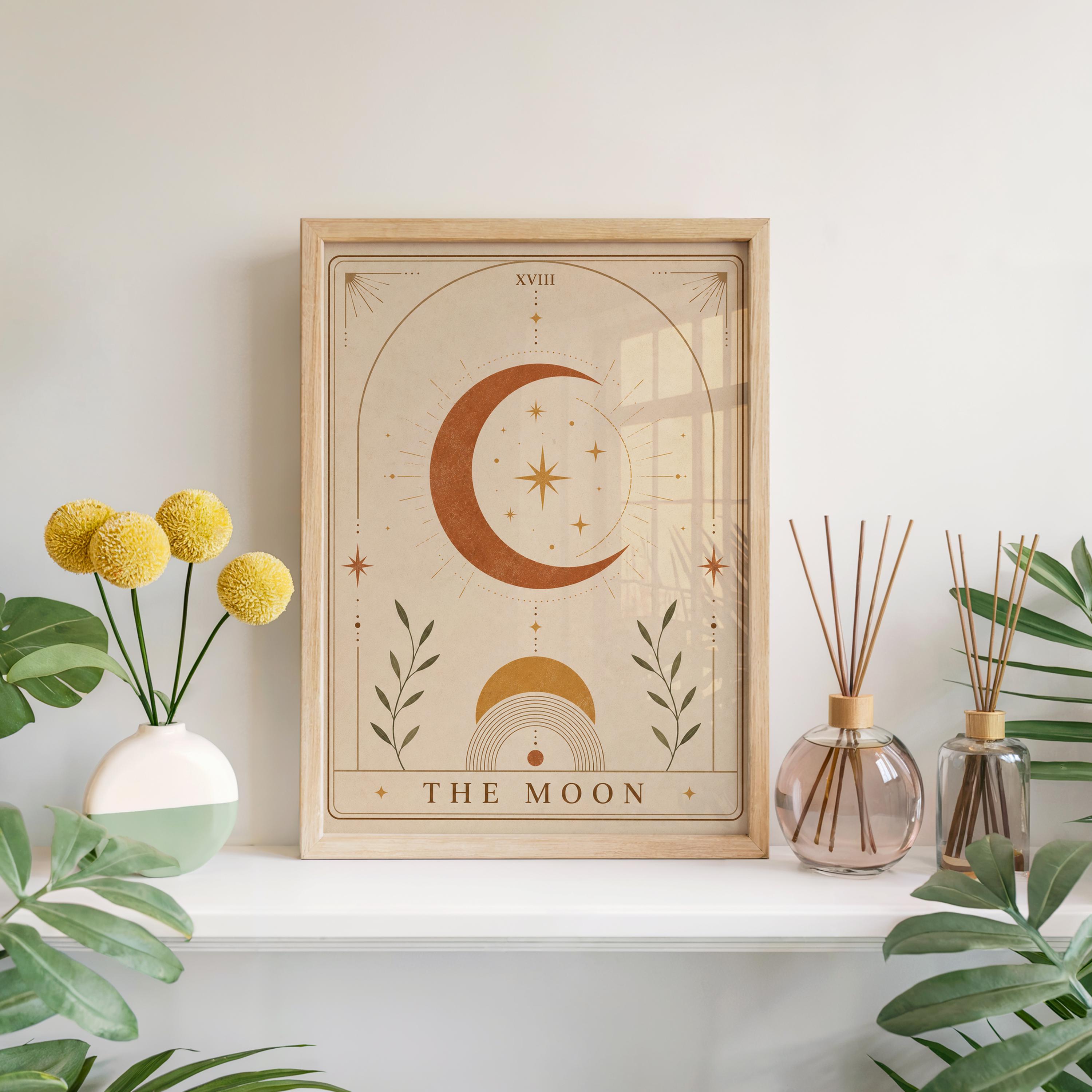 Terracotta The Moon tarot card poster framed on white shelf with yellow flowers and diffuser.