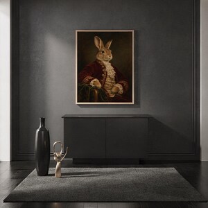 Regal rabbit portrait wall art print standing on a countertop in a modern white kitchen.