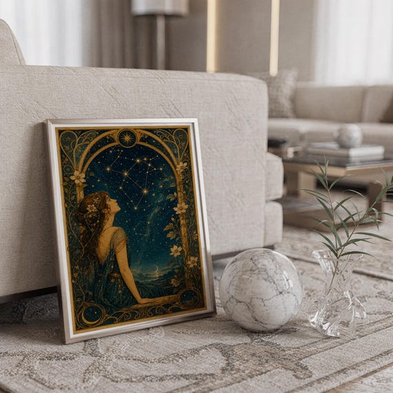 Celestial woman wall art print standing on a countertop in a modern white kitchen.