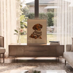 Dachshund sweater wall art print framed and displayed in a modern home interior.