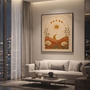 Celestial sun and moon wall art print hanging above a light gray sofa in a modern living room with evening city views through tall windows.