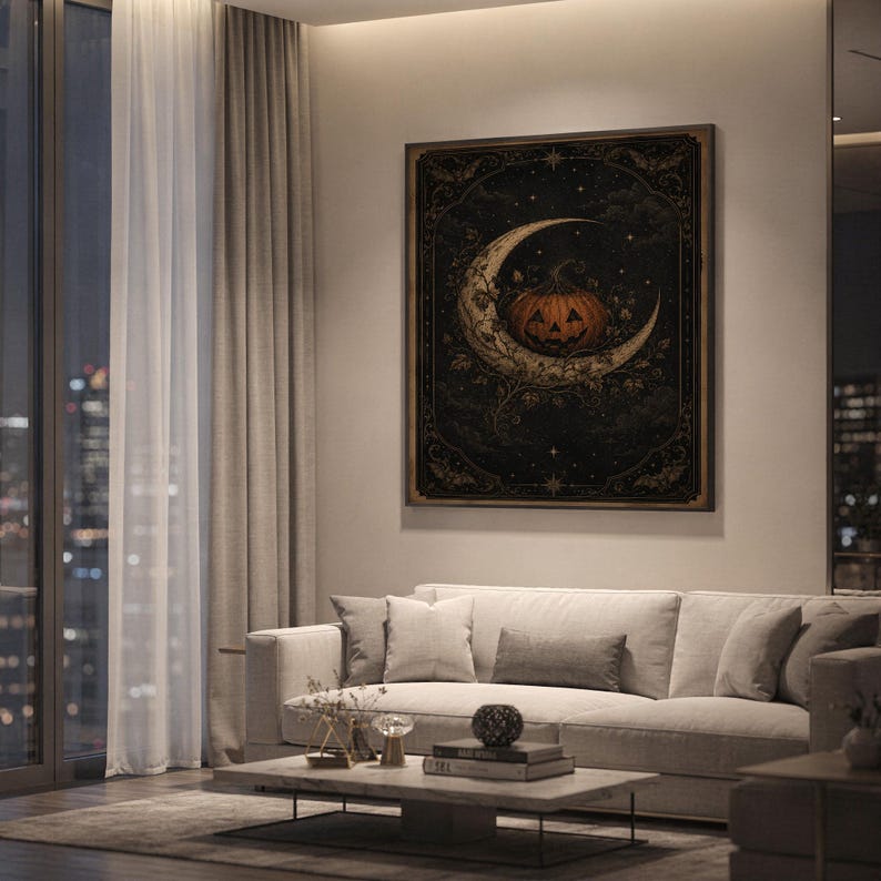Vintage halloween moon wall art print hanging above a light gray sofa in a modern living room with evening city views through tall windows.