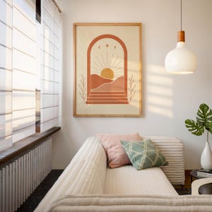 Warm earthy sun and arch wall art displayed in sunlit cozy interior room