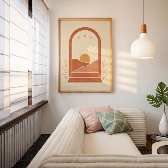 Warm earthy sun and arch wall art displayed in sunlit cozy interior room