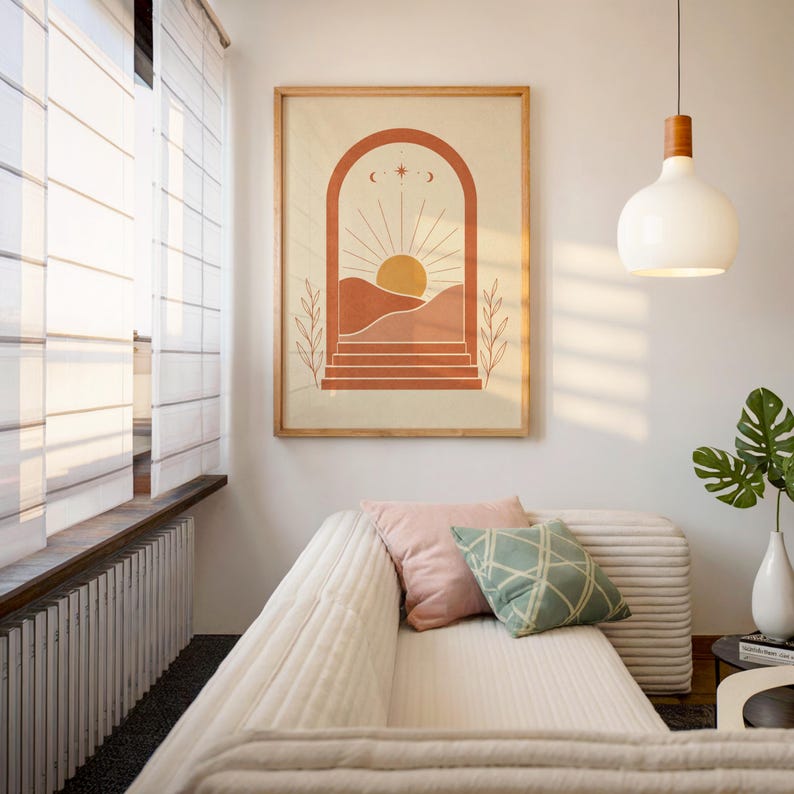 Warm earthy sun and arch wall art displayed in sunlit cozy interior room