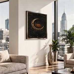 Vintage halloween moon wall art print hanging above a stone countertop with a fruit bowl in a sunny kitchen.