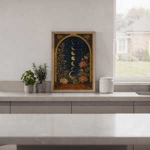 Moon phase wall art print hanging in a high-rise apartment living room with a city skyline view.
